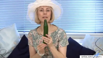 Mature housewife fucks a cucumber